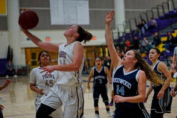 Lemoore's Katlyn Cole scores in Tuesday's game against Redwood High School.